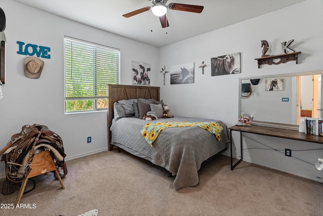 26032 W Quail Ave, Buckeye, AZ 85396 - bedroom with light carpet, baseboards, and a ceiling fan