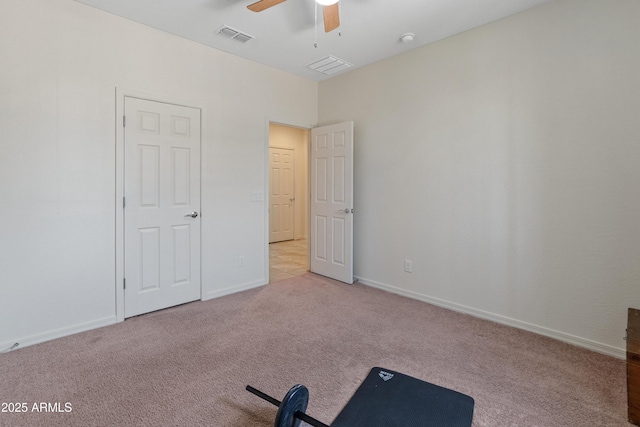 26032 W Quail Ave, Buckeye, AZ 85396 - unfurnished bedroom with carpet flooring, baseboards, and ceiling fan