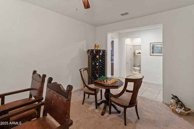 26032 W Quail Ave, Buckeye, AZ 85396 - dining area with a ceiling fan, light carpet, baseboards, and light tile patterned flooring