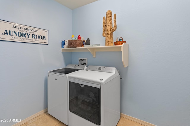 26032 W Quail Ave, Buckeye, AZ 85396 - washroom featuring washing machine and clothes dryer, baseboards, and light tile patterned floors