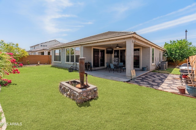 26032 W Quail Ave, Buckeye, AZ 85396 - rear view of house with ceiling fan, central AC unit, a patio area, and stucco siding