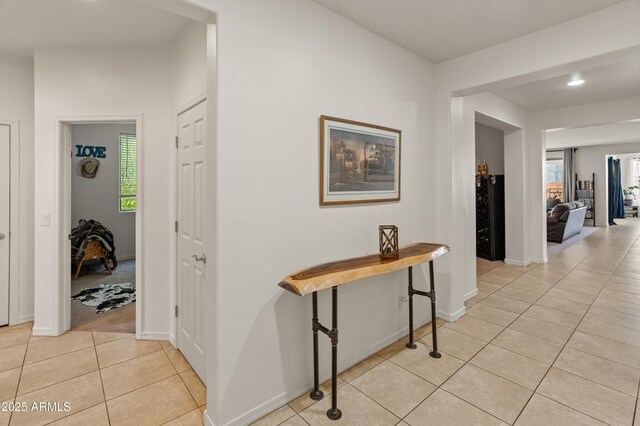 26032 W Quail Ave, Buckeye, AZ 85396 - hallway with light tile patterned floors, healthy amount of natural light, baseboards, and recessed lighting