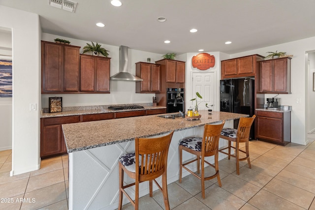 26032 W Quail Ave, Buckeye, AZ 85396 - kitchen with wall chimney exhaust hood, a sink, recessed lighting, light tile patterned floors, and black appliances
