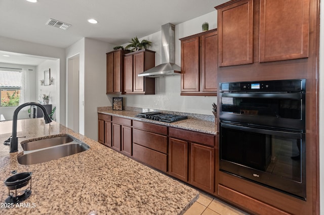 26032 W Quail Ave, Buckeye, AZ 85396 - kitchen featuring wall chimney exhaust hood, a sink, black appliances, light stone countertops, and recessed lighting