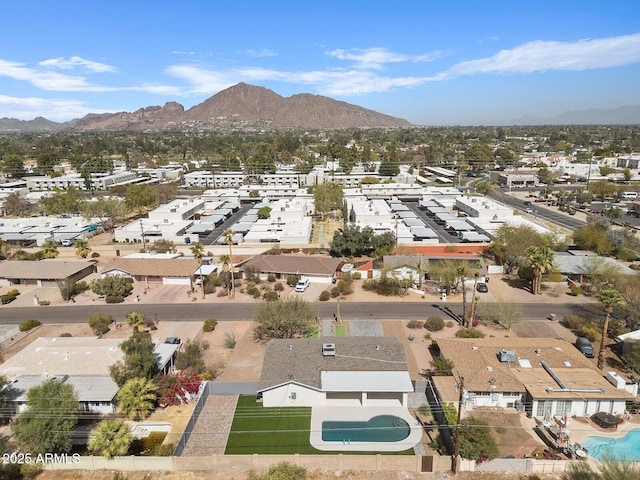 birds eye view of property with a mountain view