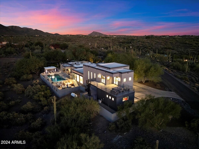 aerial view at dusk with a mountain view