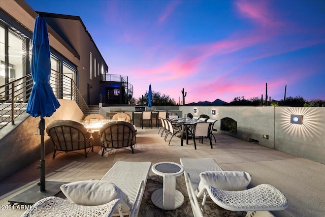 view of patio terrace at dusk