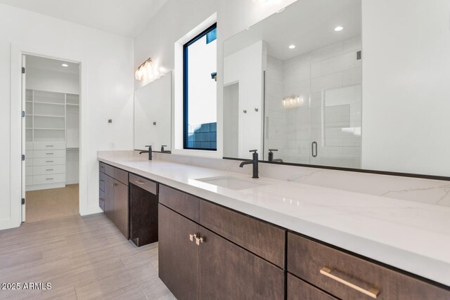 6727 N 9th Dr, Phoenix, AZ 85013 - full bath with a stall shower, double vanity, and a walk in closet