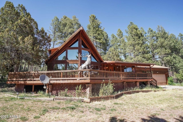 back of property featuring a wooden deck