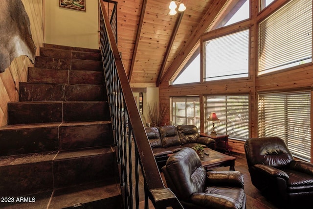 interior space with high vaulted ceiling, wooden ceiling, and beam ceiling