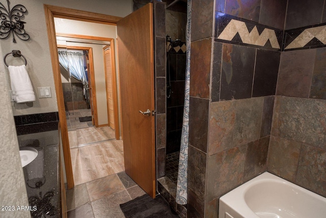 bathroom with tile flooring and plus walk in shower