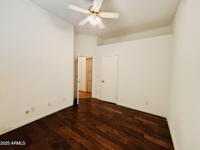 unfurnished bedroom featuring ceiling fan, baseboards, and wood finished floors