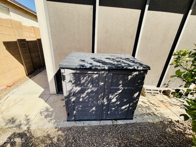 details with stucco siding and fence