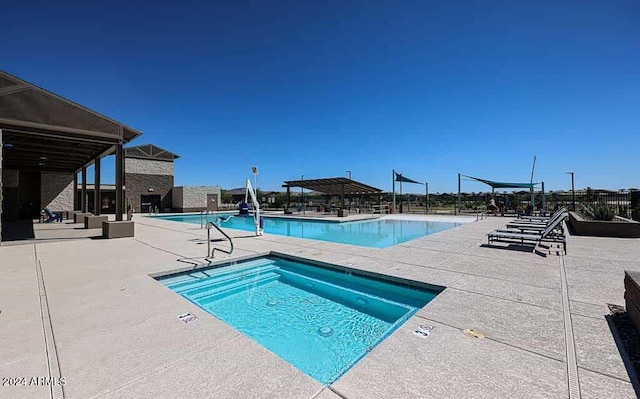 view of swimming pool featuring a patio area