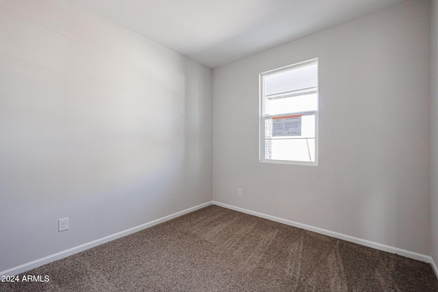 empty room with carpet flooring