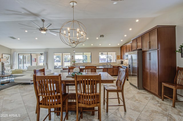 dining room with sink and vaulted ceiling