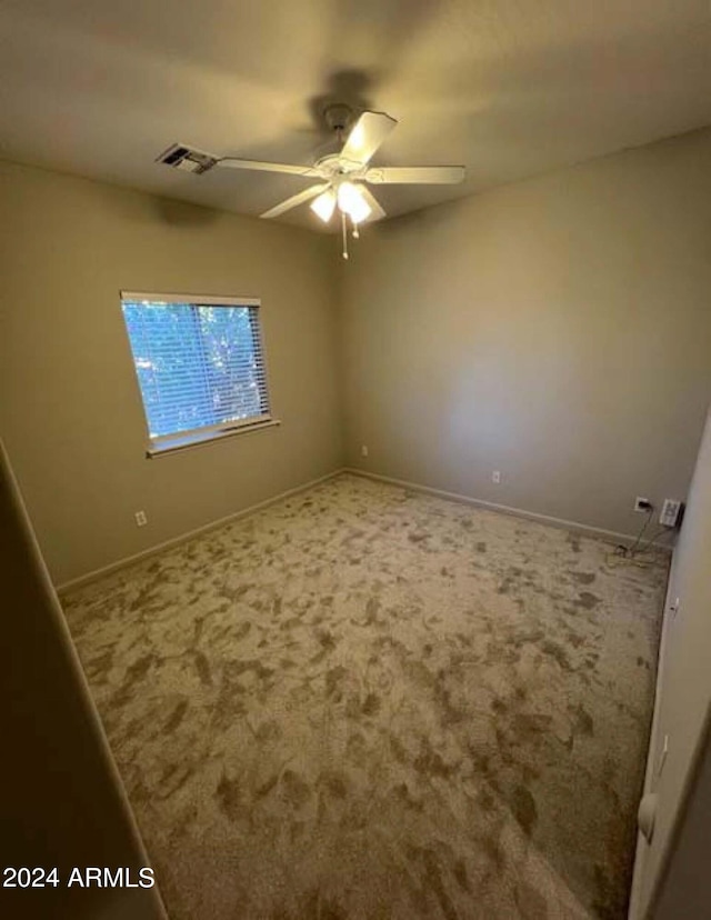 carpeted empty room with ceiling fan