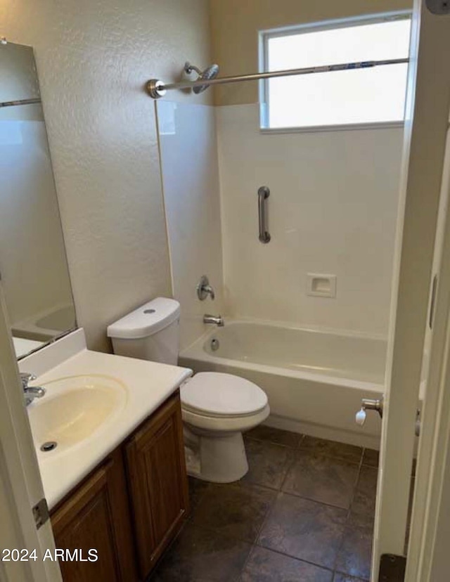 full bathroom featuring vanity, bathing tub / shower combination, toilet, and tile patterned floors