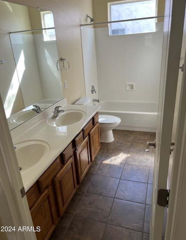 full bathroom featuring shower / bathing tub combination, vanity, toilet, and tile patterned floors