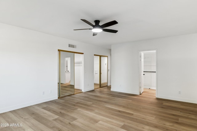 spare room featuring light hardwood / wood-style flooring and ceiling fan