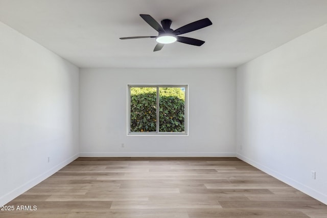 spare room with light hardwood / wood-style flooring and ceiling fan