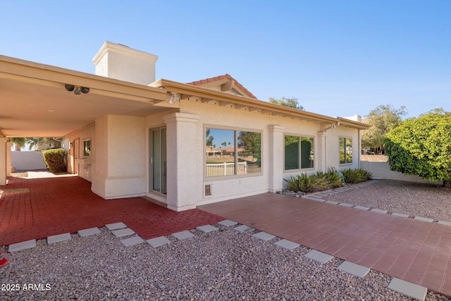 rear view of house featuring a patio