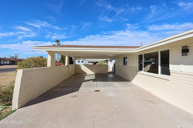 view of vehicle parking with a carport