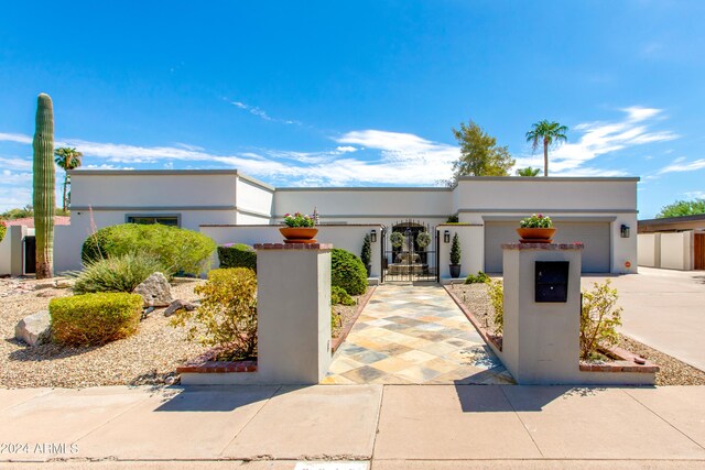 art deco inspired home with a garage