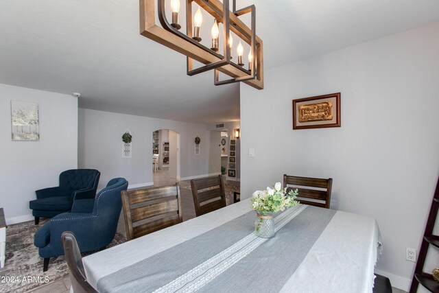 dining area featuring an inviting chandelier