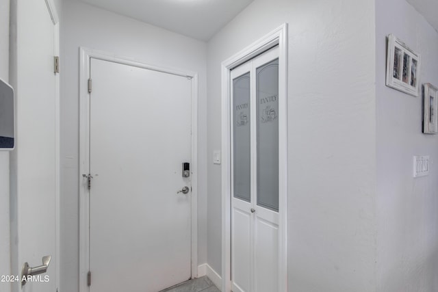 doorway to outside featuring light tile patterned floors