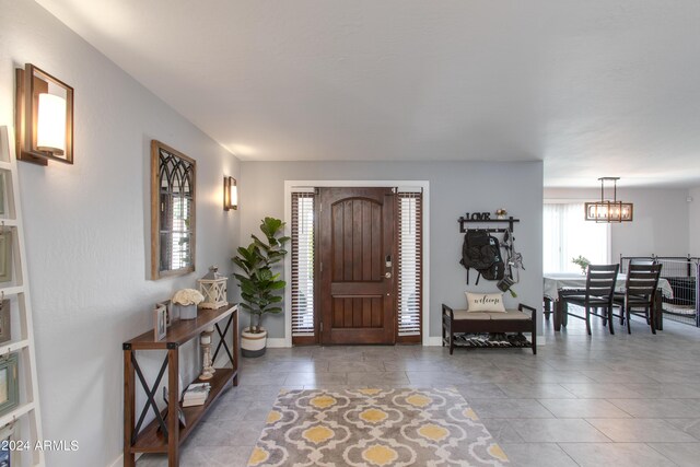 entryway featuring a chandelier