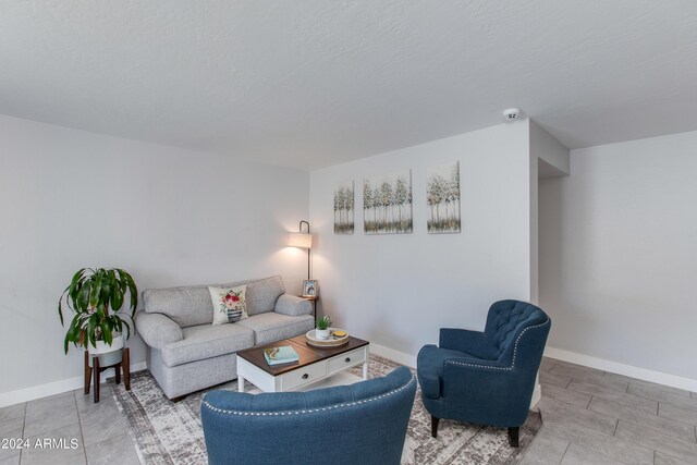 living room featuring a textured ceiling