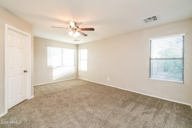 unfurnished room featuring carpet and ceiling fan