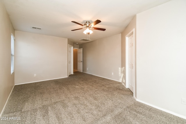 spare room with carpet flooring and ceiling fan