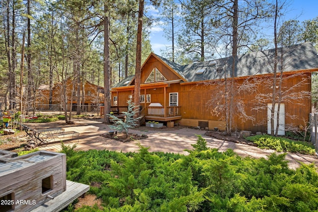 3123 S Indian Paint Ln, Pinetop, AZ 85935 - rear view of property featuring a wooden deck, a shingled roof, and crawl space
