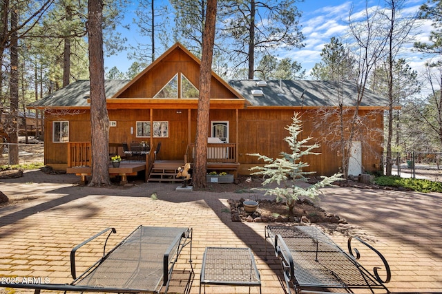 3123 S Indian Paint Ln, Pinetop, AZ 85935 - back of property with a wooden deck