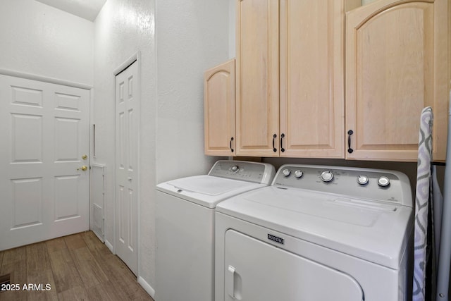 3123 S Indian Paint Ln, Pinetop, AZ 85935 - laundry area with separate washer and dryer, wood finished floors, and cabinet space