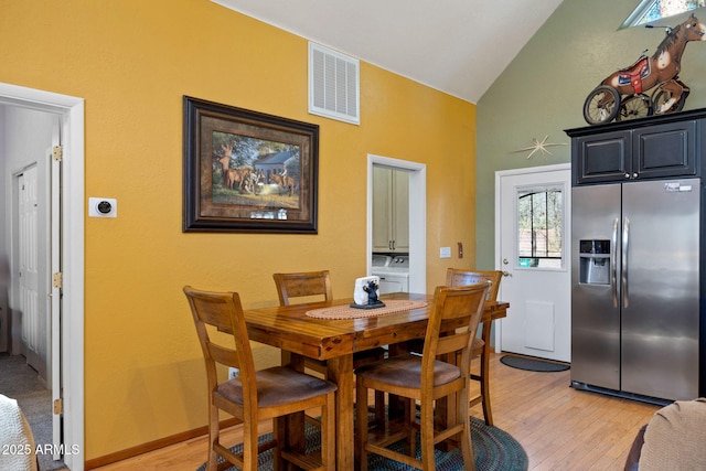 3123 S Indian Paint Ln, Pinetop, AZ 85935 - dining room featuring high vaulted ceiling and light wood-style flooring