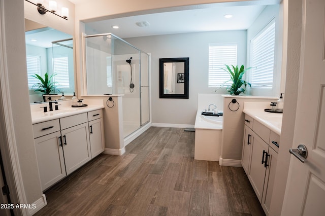 4226 E Coconino Pl, Chandler, AZ 85249 - full bathroom featuring a stall shower, wood finished floors, healthy amount of natural light, and recessed lighting