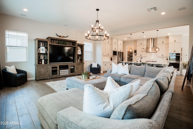 4226 E Coconino Pl, Chandler, AZ 85249 - living room with a chandelier, plenty of natural light, recessed lighting, and wood finished floors