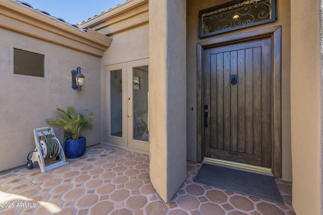 property entrance featuring french doors