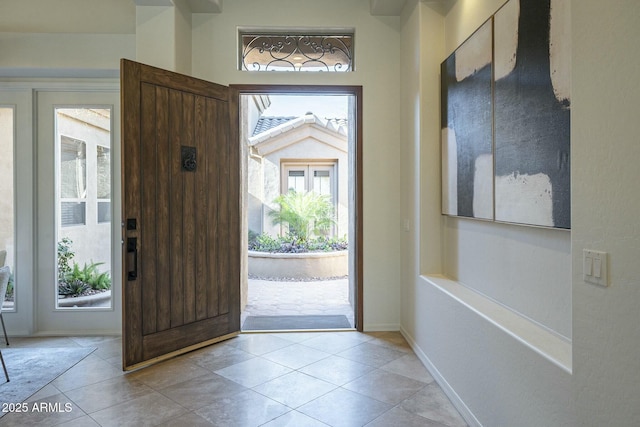 foyer with light tile patterned flooring