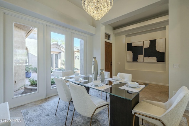 dining space featuring a notable chandelier