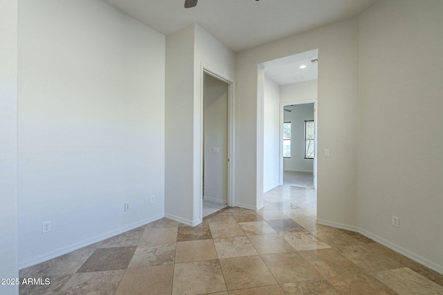 spare room with ceiling fan