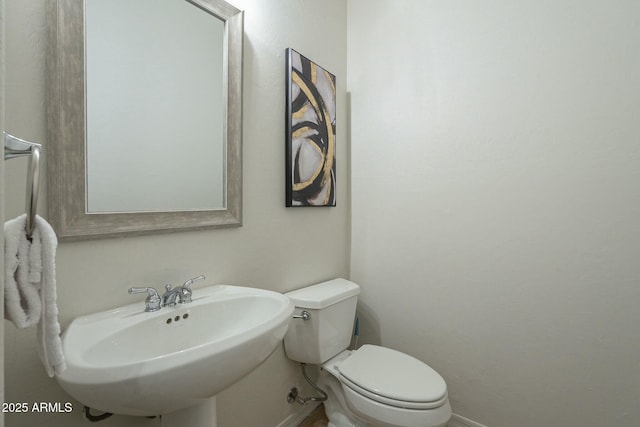 bathroom with toilet and sink