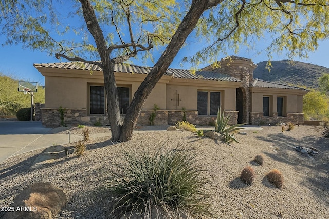 back of house featuring a mountain view