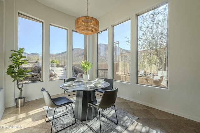 sunroom with a mountain view