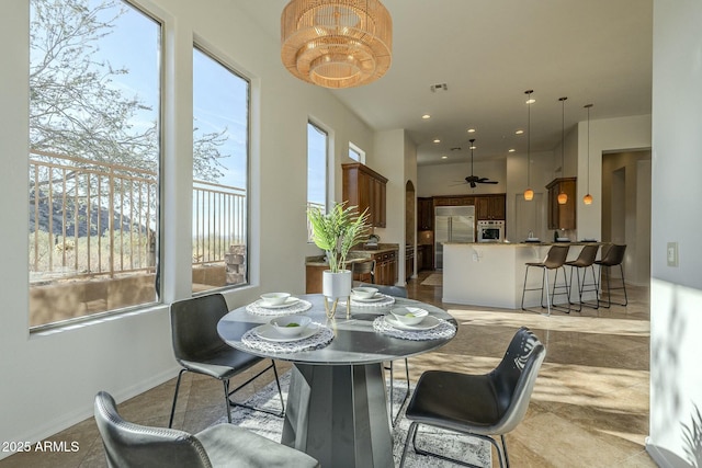 dining space featuring ceiling fan