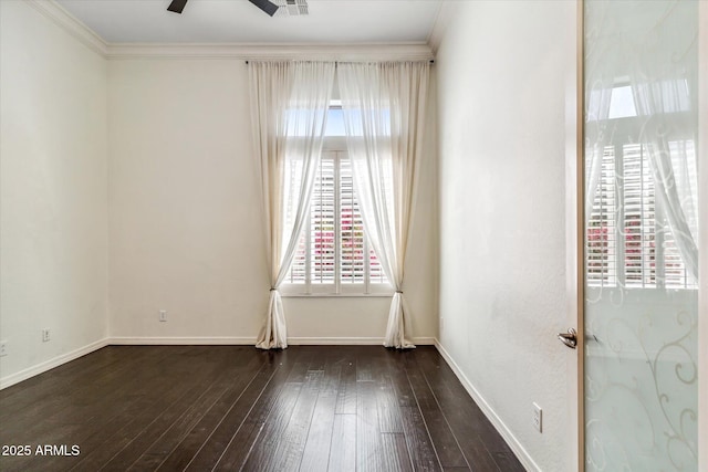 empty room with baseboards, ornamental molding, a ceiling fan, and hardwood / wood-style flooring