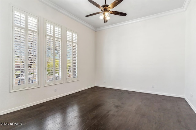 empty room featuring dark wood-style floors, baseboards, crown molding, and ceiling fan